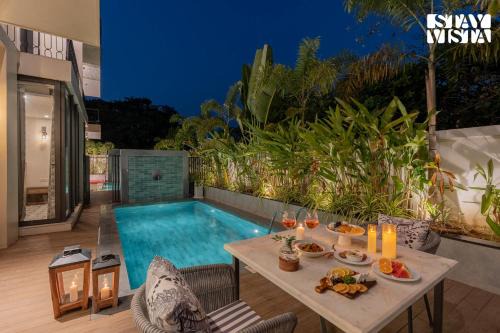 Vagator Villa | StayVista at The Heliconia Bungalows with BBQ & Pool