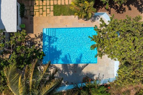 Vaijanath Villa | StayVista's Santoni Farms - Riverside Bliss with Pool, Orchard & Activities