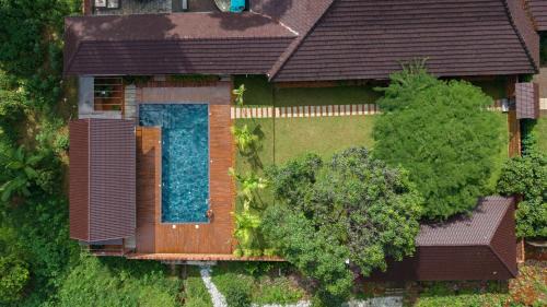 Kothamangalam Villa | ELIVAAS Signature Tales By Tamarind 200 Year-Old 3 BHK Forest Villa with Pvt Pool, Garden, Gazebo, Backyard & Open-Air Shower Courtyard