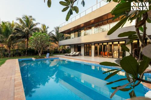 Reflection House by StayVista with Pool, Terrace bar, Indoor games & Exquisite interiors in a nutshell in Alibaug