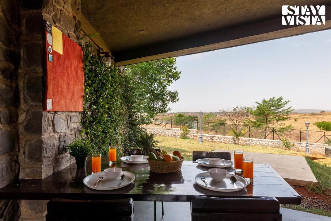 Nashik Villa | Stone House Bezze by StayVista with Lake view, Jacuzzi & Lawn - your perfect getaway