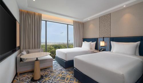 Twin Guest Room with Runway View with 50% discount on Buffet Dining, 15% discount on laundry , 20% discount on à la carte and Happy Hours 1+1 offer on select beverages from 4pm to 8pm