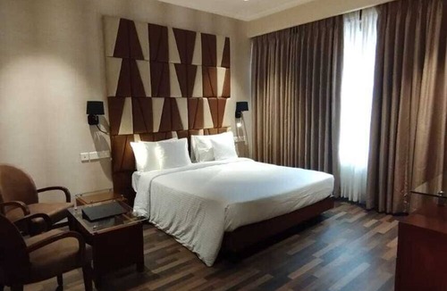 Girgaon Hotel | Adiva Residency Beacon, Grant Road, Mumbai