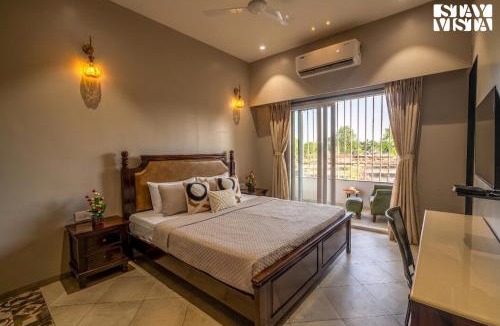 Turiya Villa | StayVista at Vannraj Farm Villa with Shared Pool & Bonfire