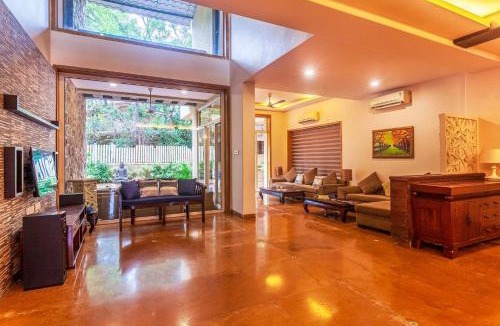 Kune Village Villa | StayVista's The Happy Hive - Cozy rooms and a pool for a delightful stay